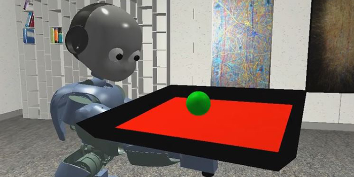 Den menneskelignende robot iCub balancerer med en bold (Foto: DTU Elektro)