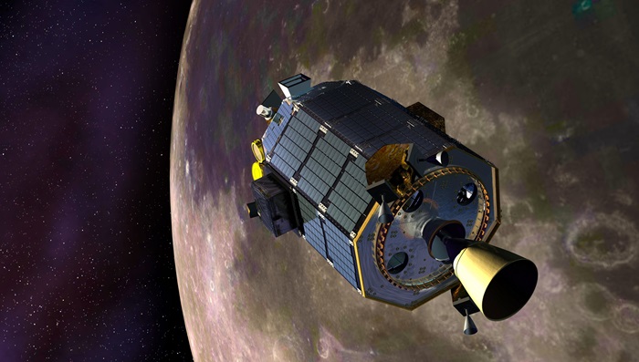 An artist's concept of NASA's Lunar Atmosphere and Dust Environment Explorer (LADEE) spacecraft orbiting the moon and preparing to fire its maneuvering thrusters to maintain a safe orbital altitude. Image credit: NASA Ames / Dana Berry