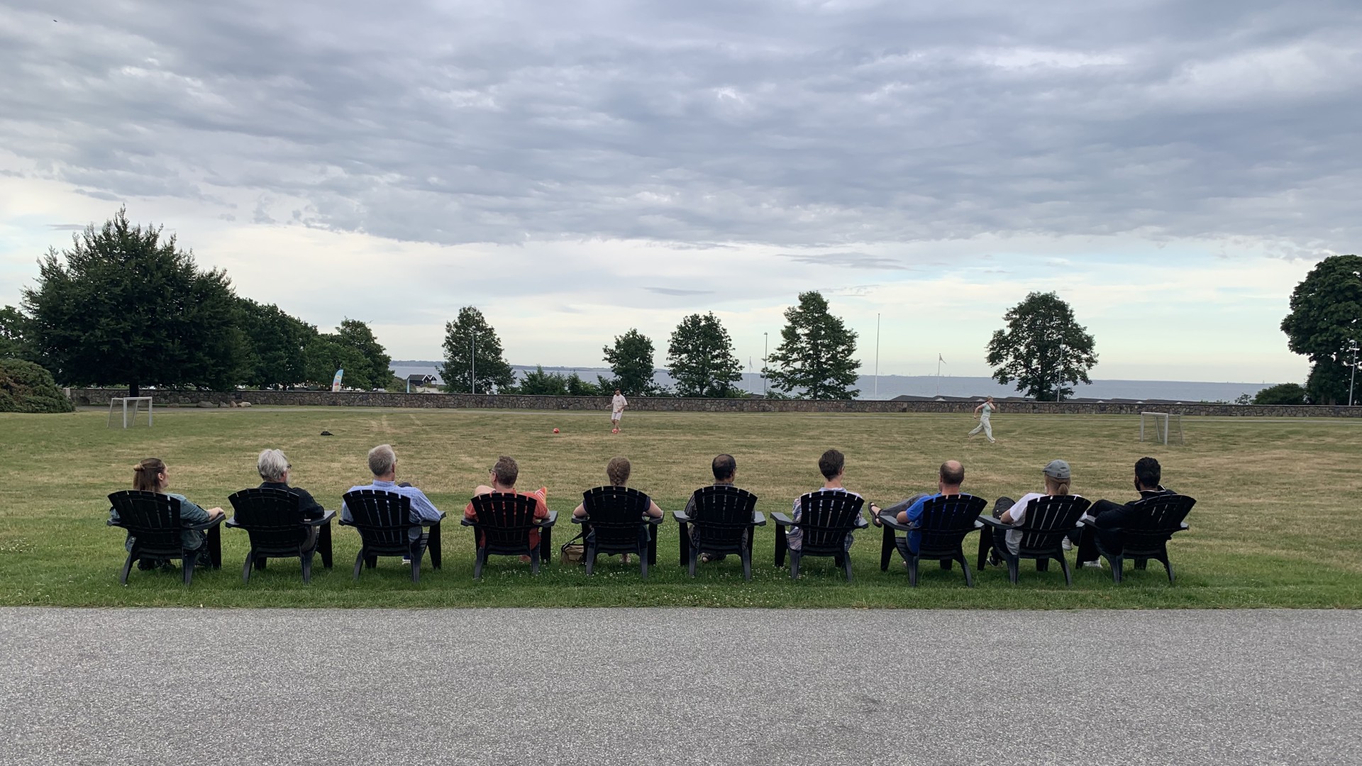 Teachers at DTU Learning Labs Summer School overlook a playing fiels